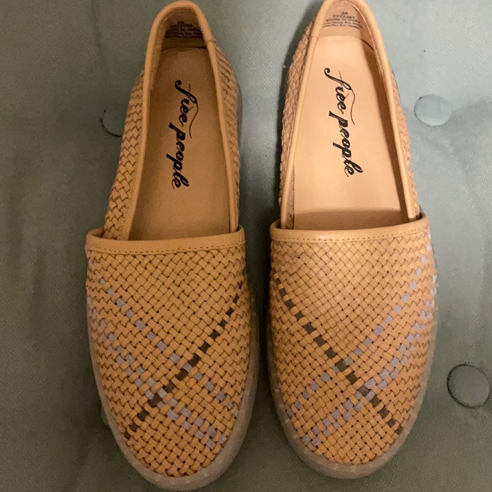Free people shoes are tan with a slight hint of peach color.